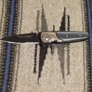 Black Serrated Folding Knife